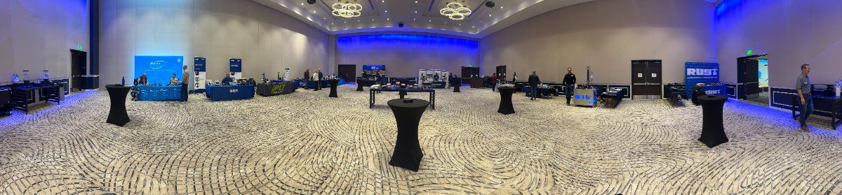 A trade show floor in Draper, Utah with vendor booths set up before the show opens